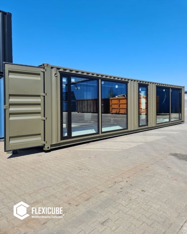 A stunning container office in a gorgeous shade of olive green! With plenty of windows, natural light will flood the space, creating a warm and inviting atmosphere. L30 🏡#officedesign #büro #containerhome #containerhouse #shippingcontainerhome #shippingcontainerhouse #container #shippingcontainer #beautifulhomes #beautifulhouse #homeinspiration #homeinterior #smallliving #modernhouse #modernhomes #cozyhouses #myhouse #cozyhome #housebuild #housedesign #containerarchitecture #flexicubepl #office #cabin #containeroffice #officegoals #homesweethome #housing #apartment #house